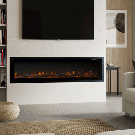 Modern recessed electric fireplace with glowing orange flames, built into a white media wall beneath a mounted TV, complemented by a sleek marble coffee table and neutral living room decor.