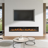 Large recessed electric fireplace with glowing orange flames, seamlessly integrated into a minimalist white wall below a built-in TV, paired with a modern round coffee table and natural light from large windows.